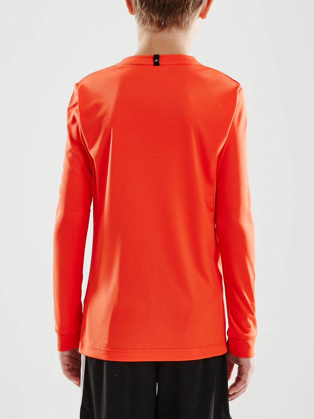 Craft Squad Go Jersey Solid LS Junior in Rostrot, Detailansicht