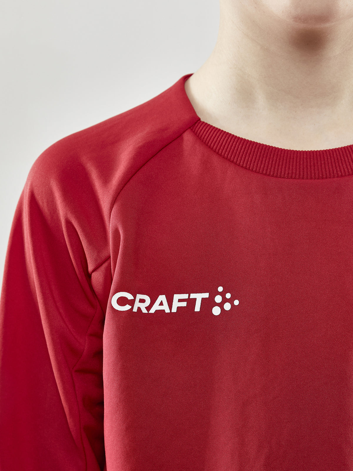 Craft Evolve Crew Neck Junior in Rot, Detailansicht