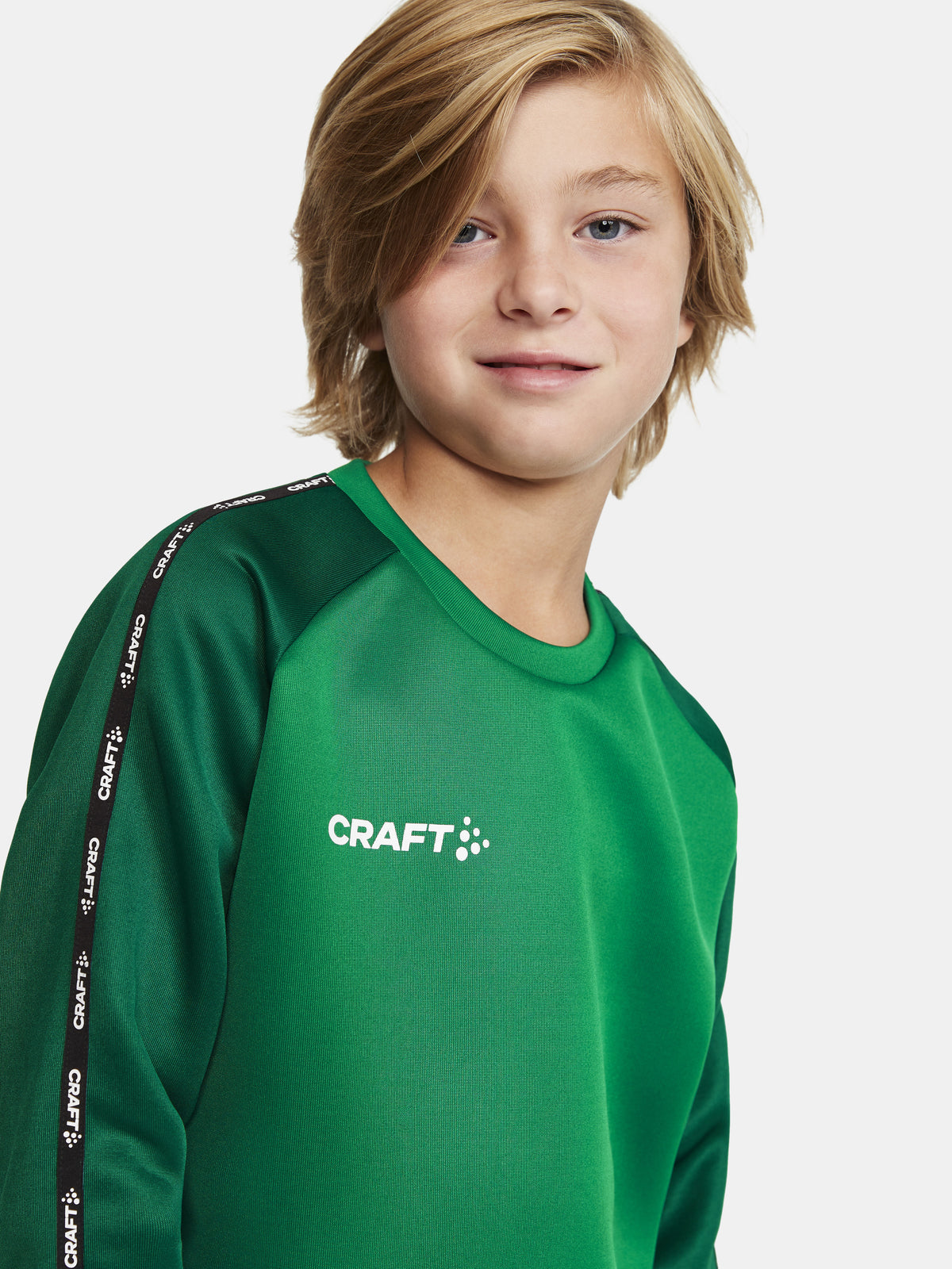 Craft Squad 2.0 Crewneck Junior in Grün/Dunkelgrün, Detailansicht